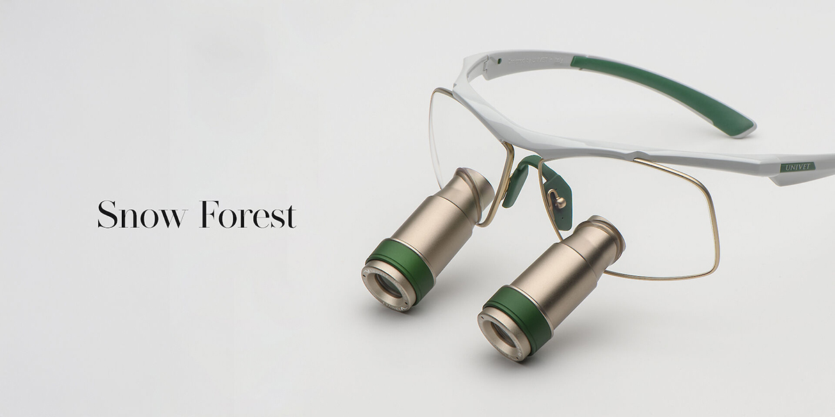 Loupes Univet Techne Prism colore Snow Forest con montatura bianca e dettagli verde foresta